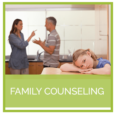 A family counseling session with two people talking to one another.