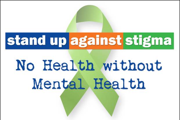 A green ribbon with the words stand up against stigma to health without mental health.