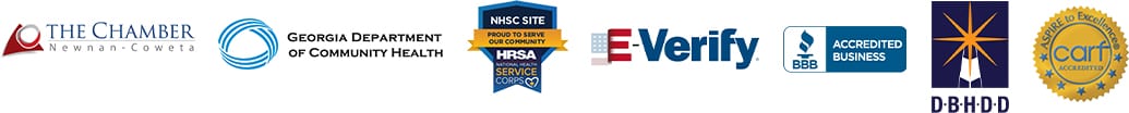 A group of logos that include the american flag and the national health service corps.