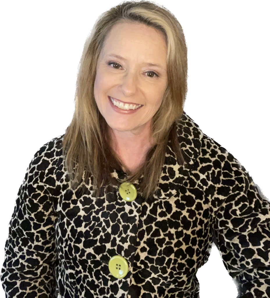 A woman in leopard print coat smiling for the camera.