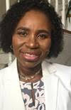Here's an alt tag for the image: Smiling woman in white jacket.